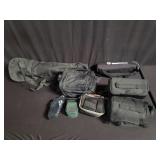 Group of camera bags and tripods
