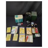 Group of vintage fishing reels, hooks,  and wire