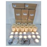 Group of battery candles and puck lights