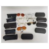 Group of vintage sunglasses and metal cases