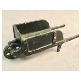 Antique painted cast iron wheelbarrow