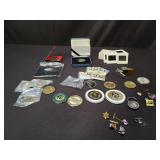 Commerative coins, pins, whistles, slides,