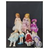 Group of porcelain and plastic dolls