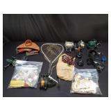 Collection of vintage fishing reels and tackle