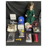 Box of misc hat, doll, tools, model airplanes etc