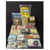 Collection of vintage military books, goggles,