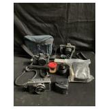 Box of cameras and accessories Canon T70, Asahi