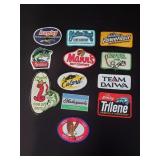 Collection of fishing patches including Berkley