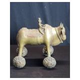 Vintage Indian brass bull on wheels with rider