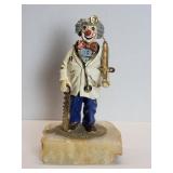 Metal clown sculpture on a onyx base