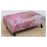 Contemporary cowhide ottoman on casters