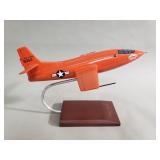 Bell X-1 model rocket plane on wood and metal