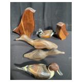 Collection of wood duck decoys and bird