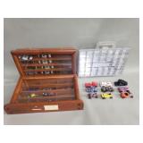 Collection of toy cars with display cases
