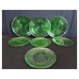 Seven green glass plates.