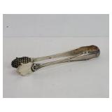 Silver tongs with makers mark