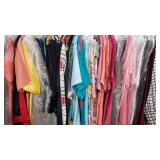 Rack of clothes, t-shirts and button shirts