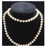 26" 14K gold strand of pearls.
