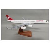 A-340 Swissair wood model airplane on stand