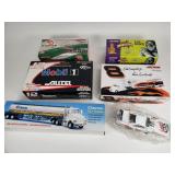 Group of die cast cars, semi-trucks
