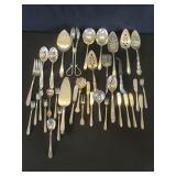 Group of silver plate serving spoons, olive
