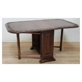 Antique English carved oak drop leaf dining table