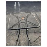 Black wrought iron square mesh outdoor patio table