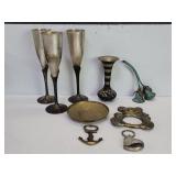 Three brass goblets, brass floral engraved vase,