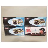 Four Nascar die-cast model cars