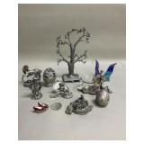 Collection of pewter figurines eggs,