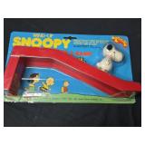 Vintage 1965 wind-up Snoopy skateboarder and ramp