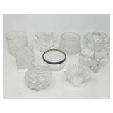 Group of glass and crystal bowls and candle
