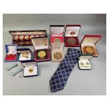 Group of Asian medallions, cufflinks & tie