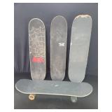 Four vintage skateboards