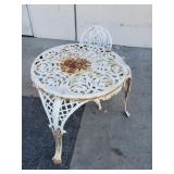 Vintage cast iron patio table and chair