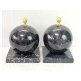 Pair of marble sphere bookends with a metal
