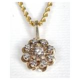 14k yellow gold and diamond flower pendant on