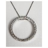 14k white gold and diamond circle pendant on a