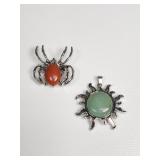 Jadeite sun pendant and red jasper spider brooch