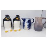 Four ceramic pitchers