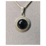 Silver and onyx pendant on a sterling chain