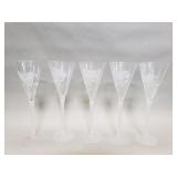 Five signed, etched crystal Champagne flutes
