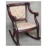 Antique mahogany rocking chair with lion head