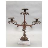 Vintage brass candelabra on marble base