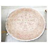 Machine-made round area rug