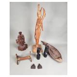 Group of carved wood figurines, bowl, candle