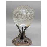 Crysta ball on a three dolphin  stand