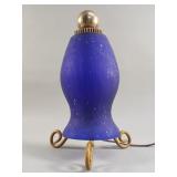 Iron table lamp with blue glass shade