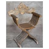 Vintage carved wood savonarola arm chair