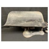 Vintage cast iron balance scale with metal scoop